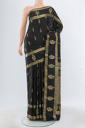 Pure Silk Pure Zari Black Kanchipuram Saree with Zari Butta on the body and Silk Border.  displayed on a mannequin