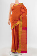Pure Silk Pure Zari Rust Kanjivaram Saree with Zari Butta on the body and Silk Border.  displayed on a mannequin