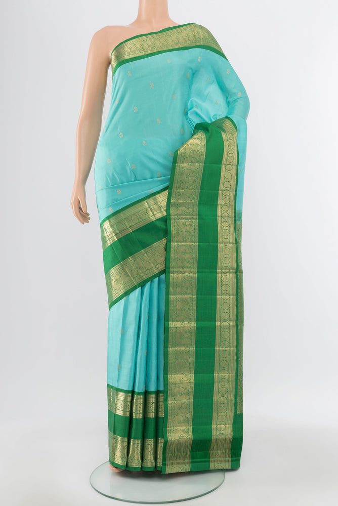 Pure Silk Pure Zari Sky Blue Kanchipuram Saree with Zari Butta on the body and Silk Border.  displayed on a mannequin