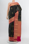 Black Kanchipuram Silk Saree with Zari Butta on the body and Silk Border.  displayed on a mannequin