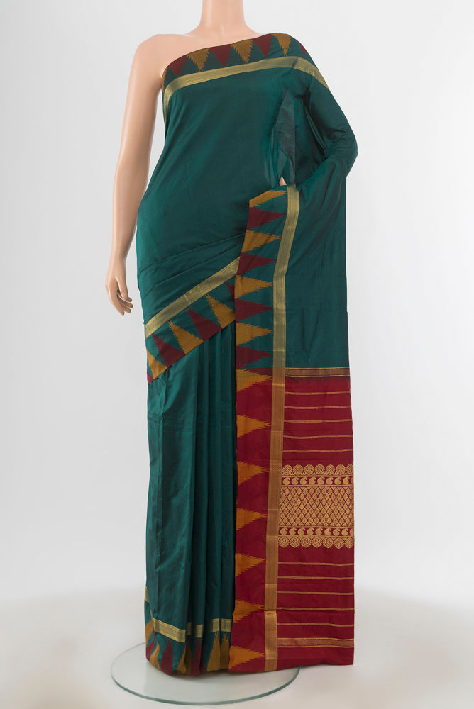 Bottle Green Bangalore Silk - kadyal Saree with Plain Body and Rising Temple Border.  displayed on a mannequin