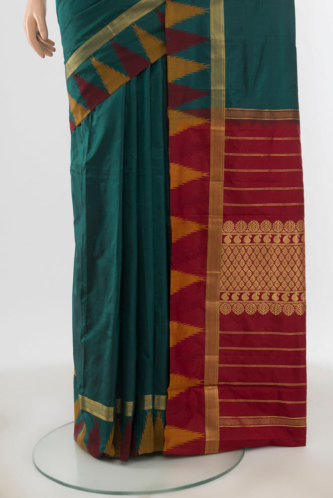 Pleats and pallu of Bottle Green Bangalore Silk - kadyal Saree with Plain Body and Rising Temple Border. 