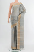 Davys Grey Soft Silk Saree with Zari Butta on the body and Zari Border.  displayed on a mannequin