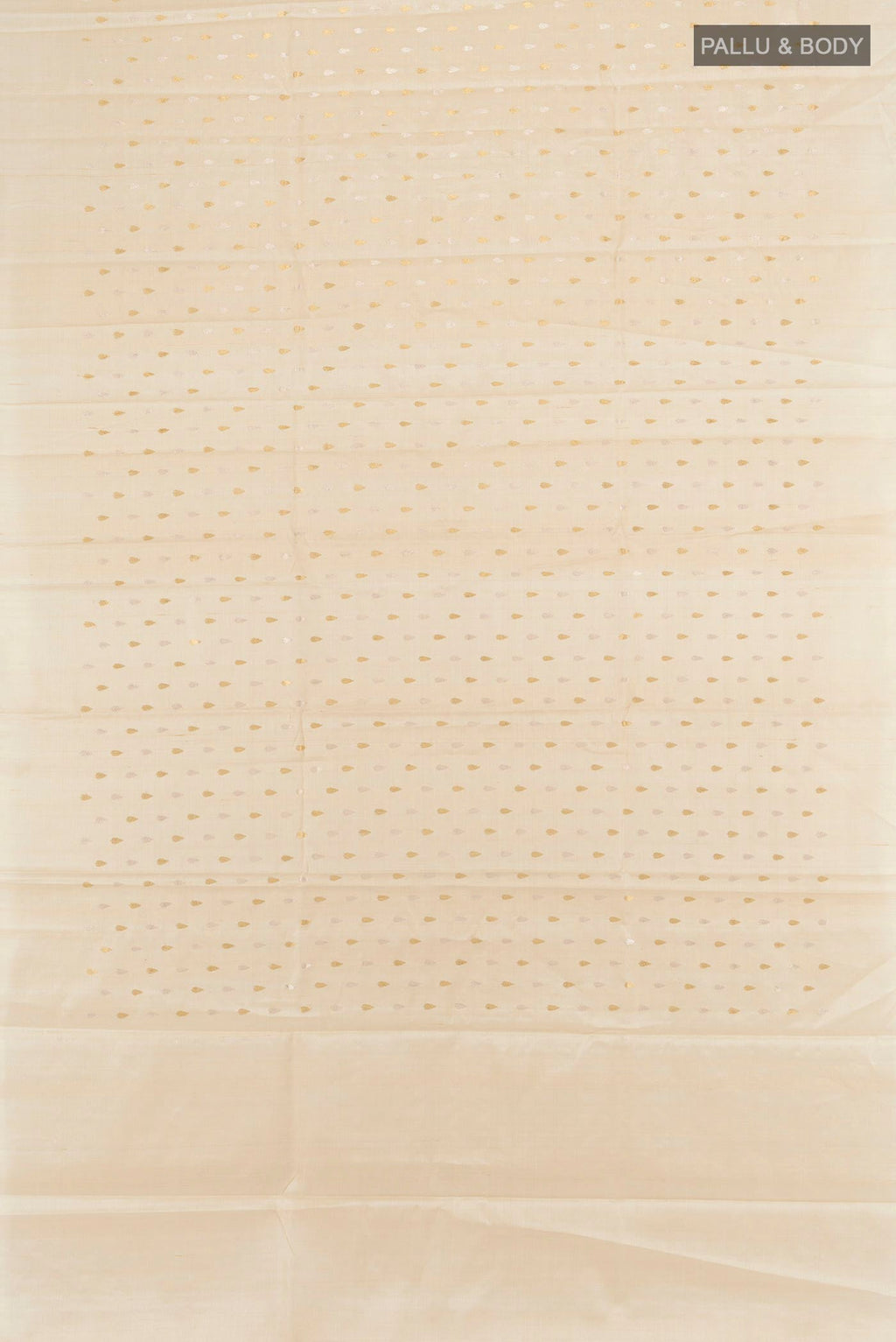 Flat view of Cream Tussar Silk Saree with Zari Butta on the body and Zari Border. 