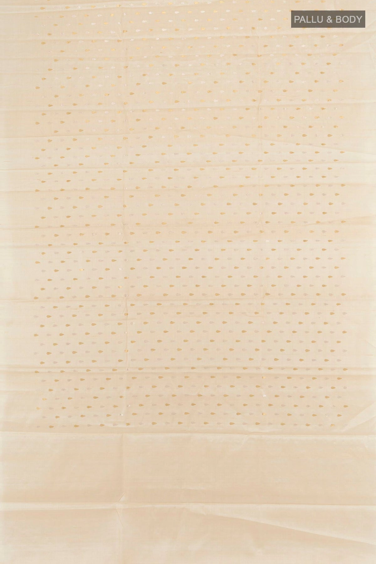 Flat view of Cream Tussar Silk Saree with Zari Butta on the body and Zari Border. 