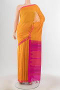 Yellow Silk Cotton Saree with Checked design on the body and Zari Border.  displayed on a mannequin