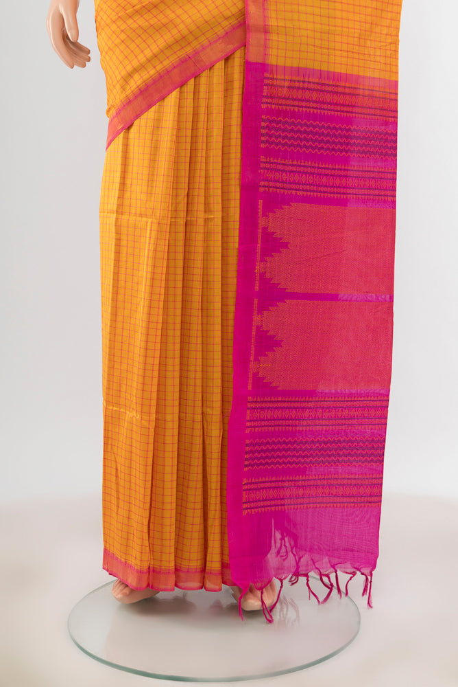Pleats and pallu of Yellow Silk Cotton Saree with Checked design on the body and Zari Border. 