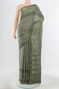 Pure Silk Pure Zari Light Green Rajkot Patola Saree with Zari Butta on the body and Silk Border.  displayed on a mannequin