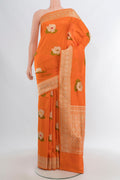 Orange Banarasi Silk Saree with Zari And Thread Butta on the body and Zari Border.  displayed on a mannequin