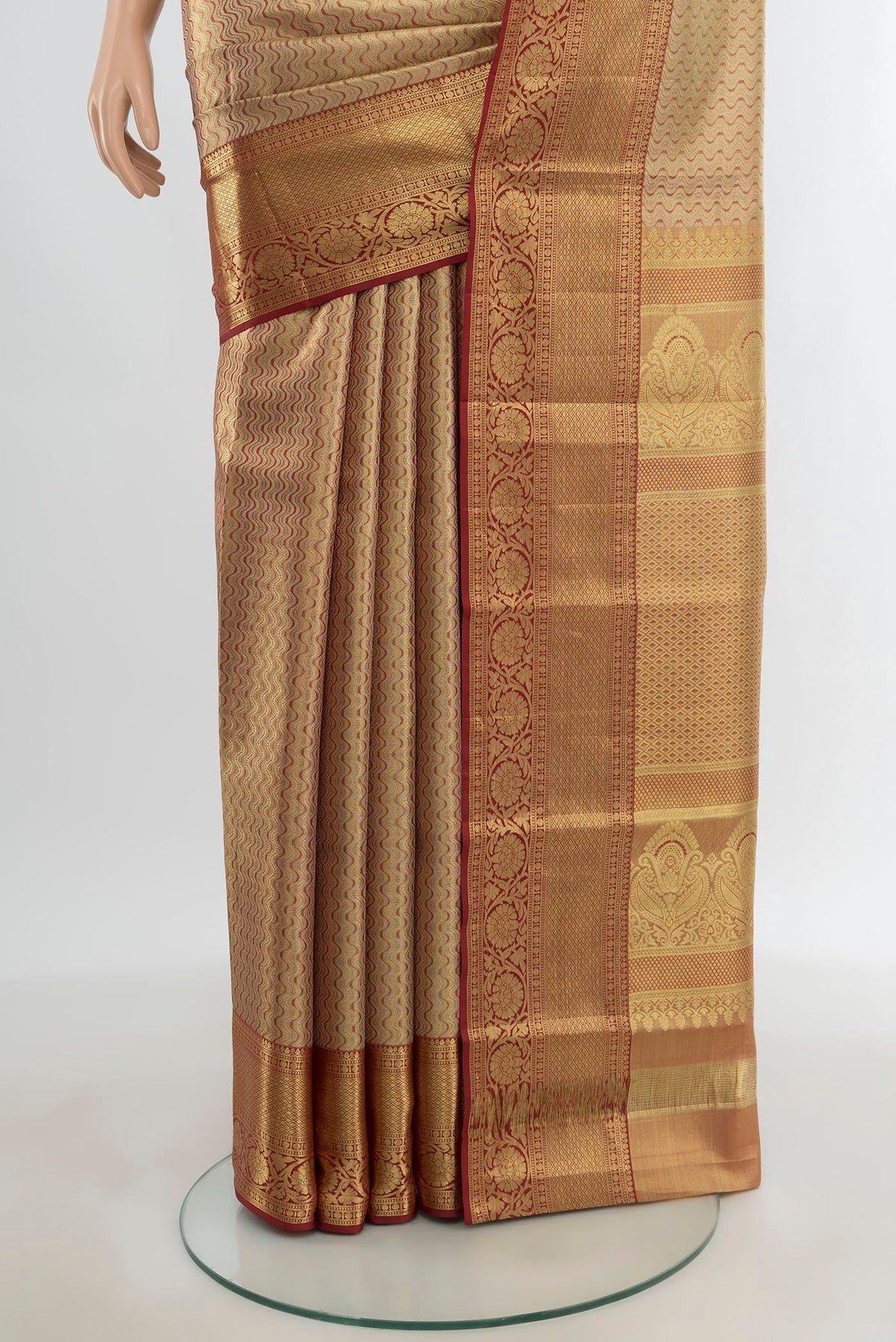 Pleats and pallu of Golden Kanjivaram Tissue Silk Saree with Zari Brocade on the body and Zari Border. 