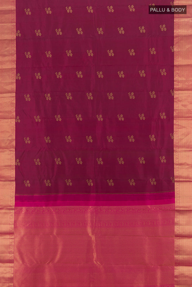 Flat view of Maroon Kanjivaram Silk Saree with Zari Butta on the body and Zari Border. 