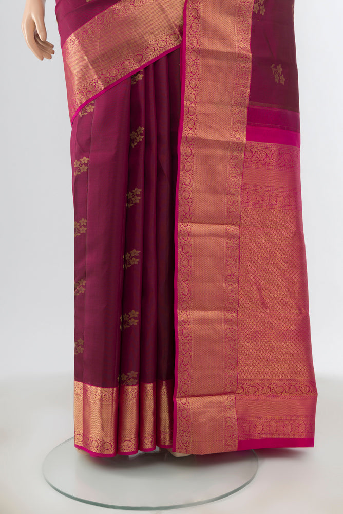 Pleats and pallu of Maroon Kanjivaram Silk Saree with Zari Butta on the body and Zari Border. 