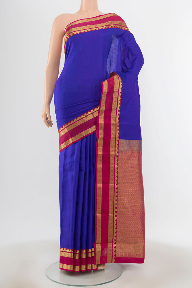 Royal Blue Kanchipuram Silk Saree with Checked design on the body and Zari Border.  displayed on a mannequin