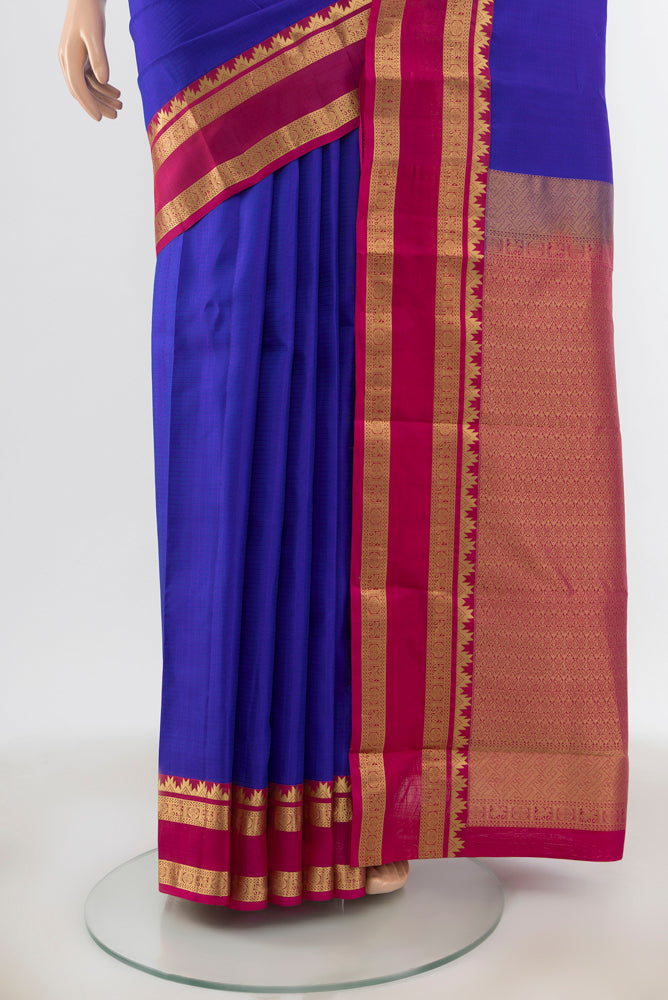 Pleats and pallu of Royal Blue Kanchipuram Silk Saree with Checked design on the body and Zari Border. 