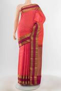 Pure Silk Pure Zari Peach Kanchipuram Saree with Zari Butta on the body and Silk Border.  displayed on a mannequin