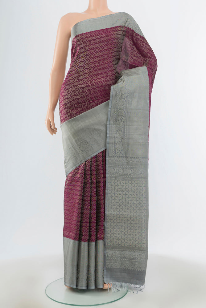 Purple Soft Silk Saree with Jacquard design on the body and Zari Border.  displayed on a mannequin