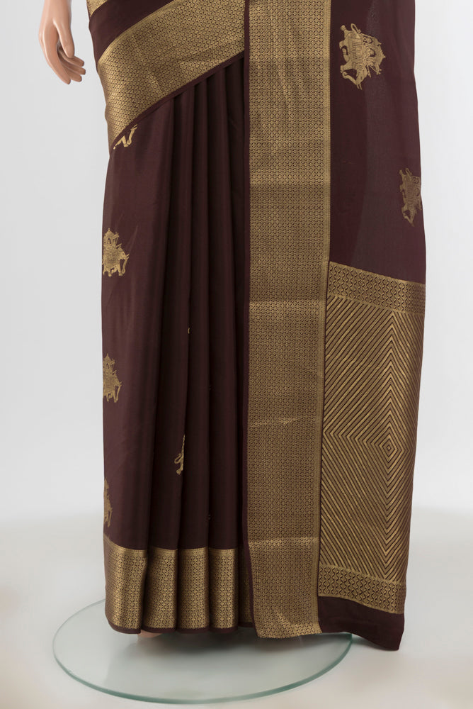 Pleats and pallu of Coffee Brown Mysore Crepe Saree with Zari Butta on the body and Zari Border. 