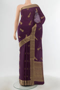 Pure Silk Pure Zari Violet Mysore Crepe Saree with Zari Butta on the body and Silk Border.  displayed on a mannequin