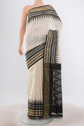 Cream Pochampally Saree with Ikat Print on the body and Silk Border.  displayed on a mannequin