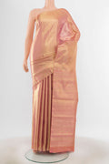 Golden Peach Kanjivaram Silk Saree with Zari Butta on the body and Silk Border.  displayed on a mannequin