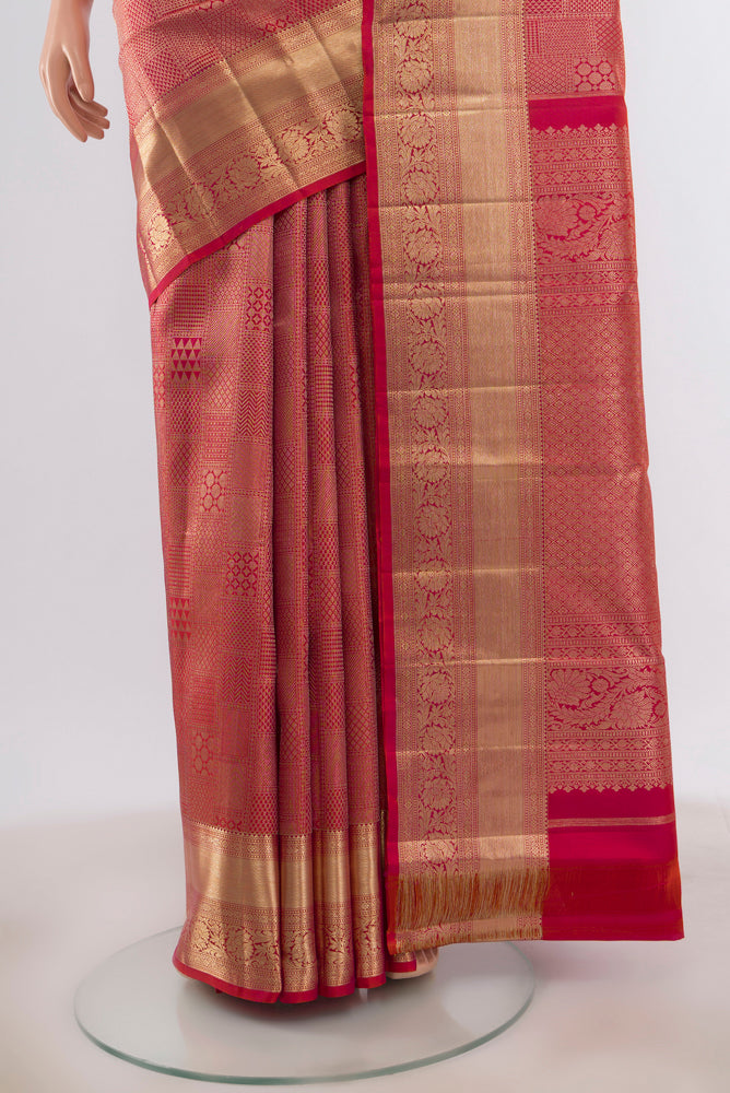 Pleats and pallu of Pink with Orange Color Kanjivaram Silk Saree with Zari Brocade on the body and Zari Border. 