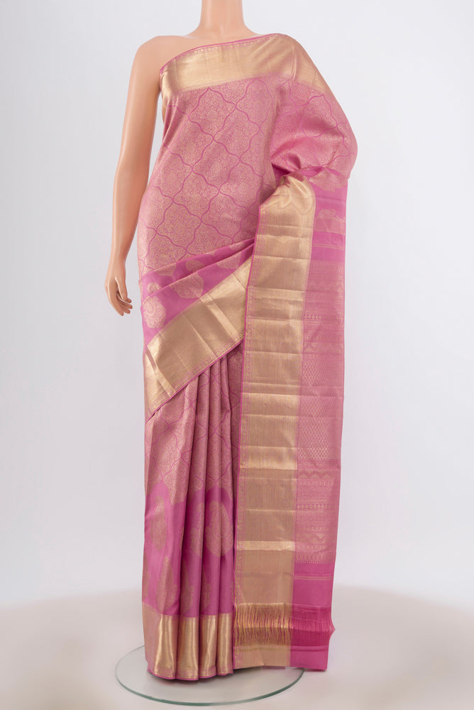 Rose pink Kanjivaram Silk Saree with Zari Brocade on the body and Zari Border.  displayed on a mannequin