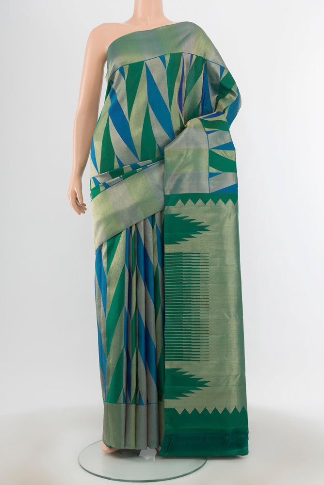 Multi Color Kanchipuram Silk Saree with Zari Butta on the body and Silk Border.  displayed on a mannequin