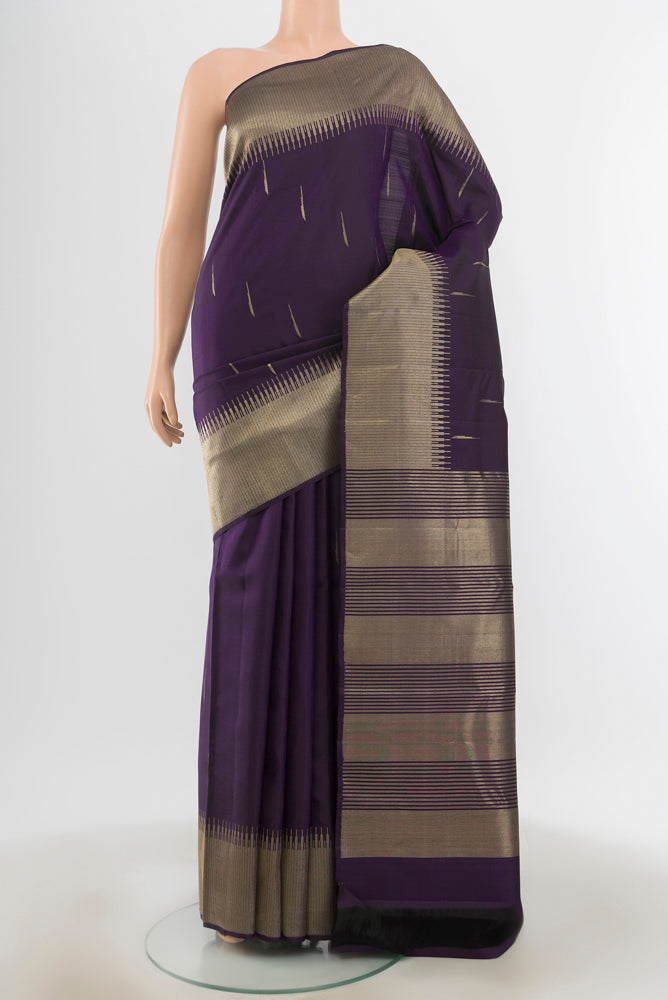 Navy Blue Kanchipuram Silk Saree with Zari Butta on the body and Zari Border.  displayed on a mannequin