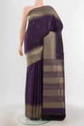 Navy Blue Kanchipuram Silk Saree with Zari Butta on the body and Zari Border.  displayed on a mannequin