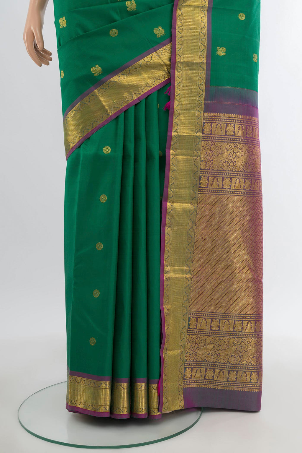 Pleats and pallu of Green Kanjivaram Silk Saree with Zari Butta on the body and Zari Border. 