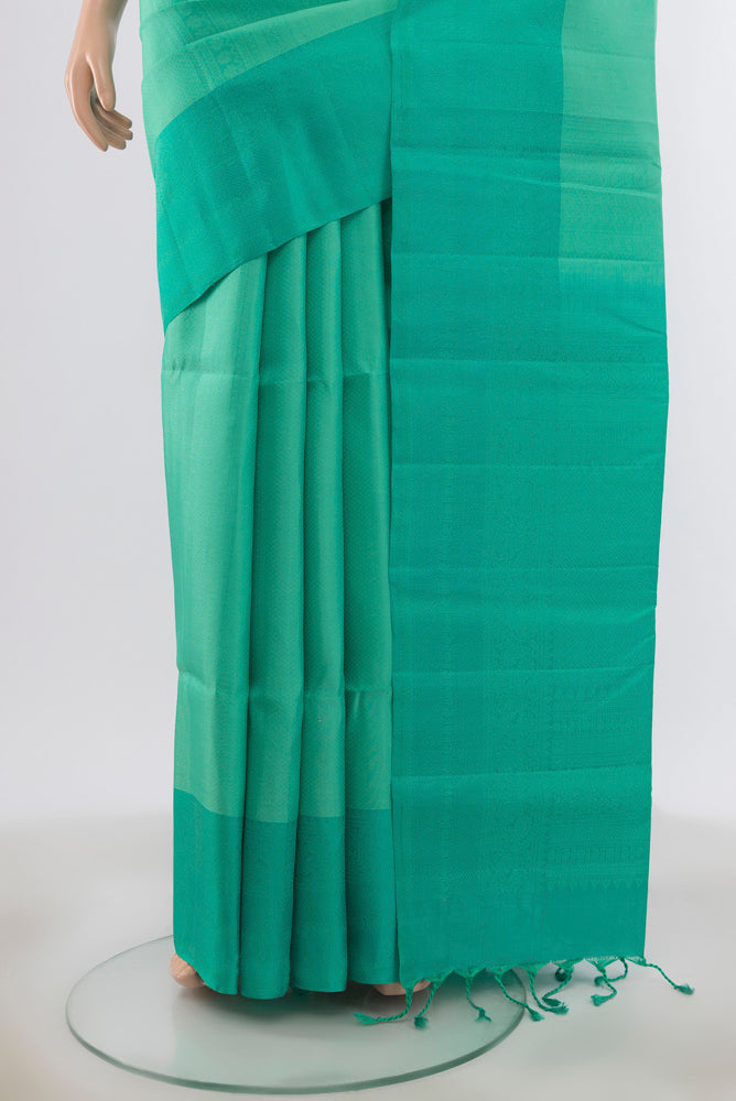 Pleats and pallu of Turquoise Soft Silk Saree with Zari Butta on the body and Plain Border. 