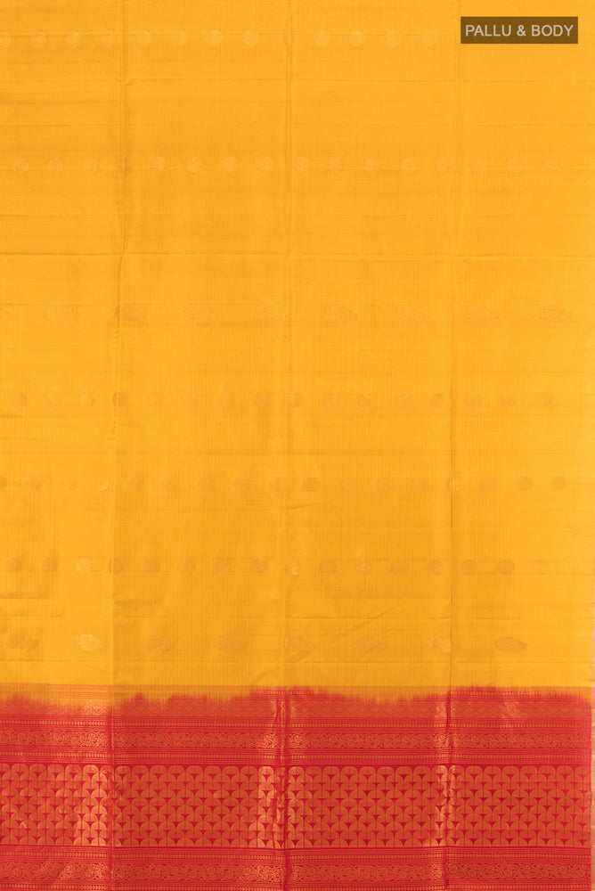 Flat view of Yellow Soft Silk Saree with Zari Butta on the body and Zari Border. 
