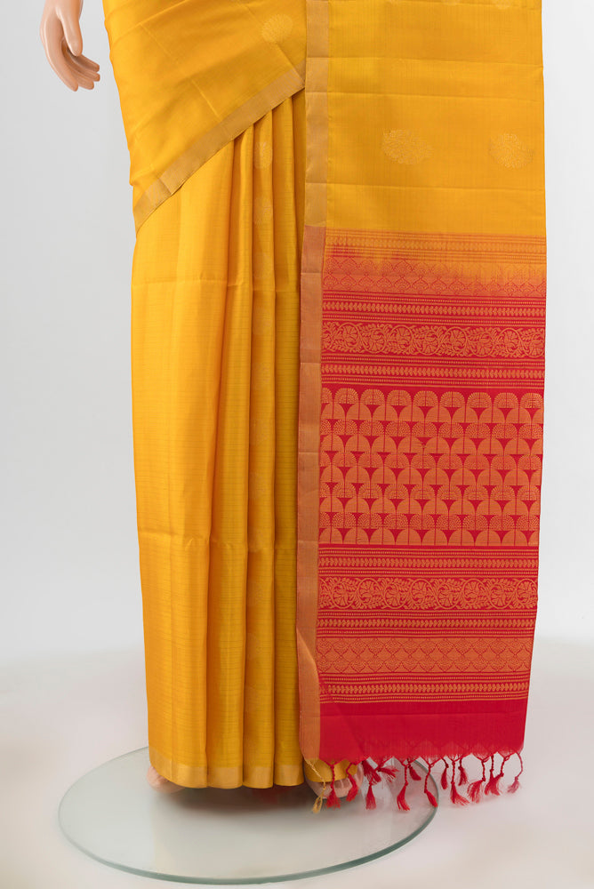 Pleats and pallu of Yellow Soft Silk Saree with Zari Butta on the body and Zari Border. 