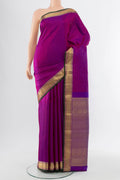 Purple Kanjivaram Silk Saree with Thread Brocade on the body and Silk Border.  displayed on a mannequin