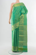 Pure Silk Pure Zari Parrot Green Kanjivaram Saree with Zari Butta on the body and Silk Border.  displayed on a mannequin