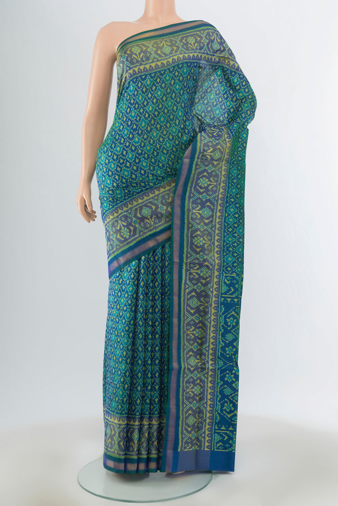 Blue Rajkot Patola Silk Saree with Pure Ikat on the body and Zari Border.  displayed on a mannequin