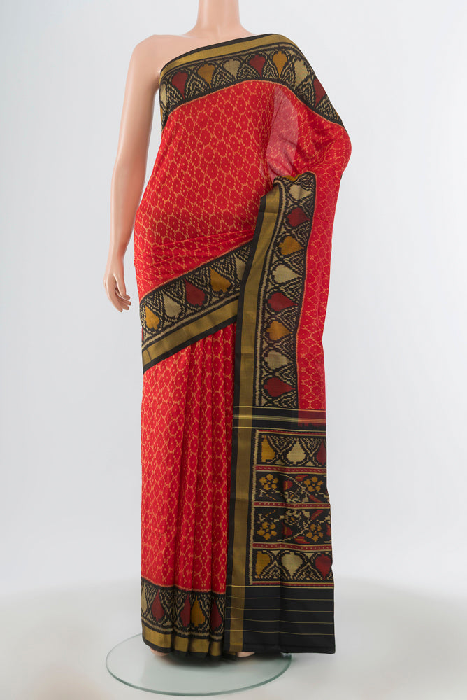 Red Rajkot Patola Silk Saree with Pure Ikat on the body and Ikat Border.  displayed on a mannequin