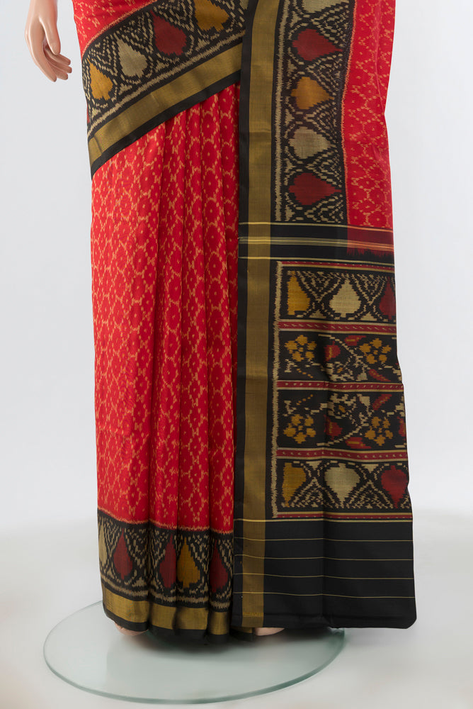 Pleats and pallu of Red Rajkot Patola Silk Saree with Pure Ikat on the body and Ikat Border. 