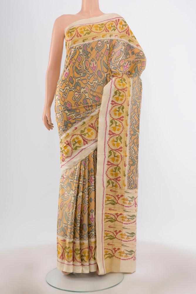 Multi Color Rajkot Patola Silk Saree with Pure Ikat on the body and Ikat Border.  displayed on a mannequin