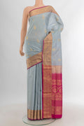 Grey Soft Silk Saree with Zari Butta on the body and Zari Border.  displayed on a mannequin