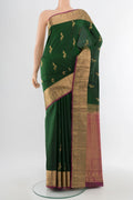 Mint Green Soft Silk Saree with Zari Butta on the body and Silk Border.  displayed on a mannequin
