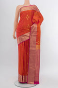 Peach Soft Silk Saree with Zari Butta on the body and Silk Border.  displayed on a mannequin
