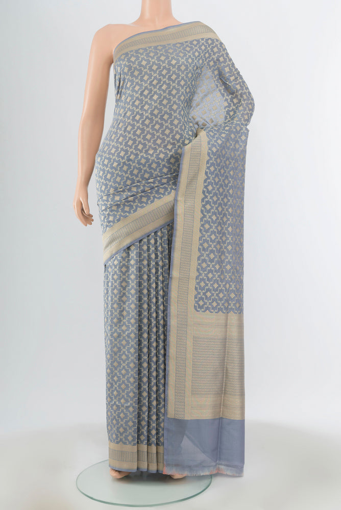 Blue Grey Banarasi Silk Saree with Zari Butta on the body and Zari Border.  displayed on a mannequin
