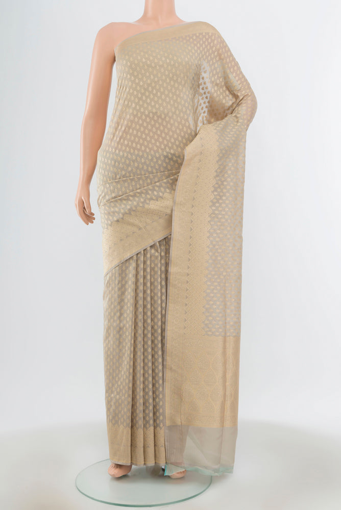 Lilac Banarasi Silk Saree with Zari Butta on the body and Zari Border.  displayed on a mannequin
