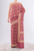 Bronze Banarasi Silk Saree with Zari Butta on the body and Silk Border.  displayed on a mannequin