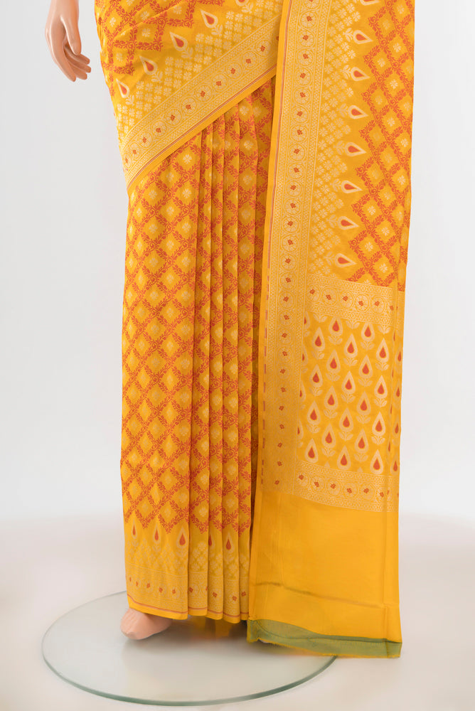 Pleats and pallu of Yellow Banarasi Silk Saree with Zari And Thread Butta on the body and Zari Border. 