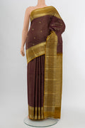 Coffee Brown Kanjivaram Silk Saree with Zari Butta on the body and Silk Border.  displayed on a mannequin