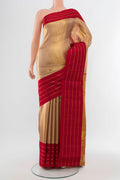 Golden Kanjivaram Silk Saree with Zari Butta on the body and Silk Border.  displayed on a mannequin