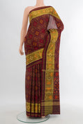 Coffee Brown Rajkot Patola Silk Saree with Pure Ikat on the body and Ikat Border.  displayed on a mannequin