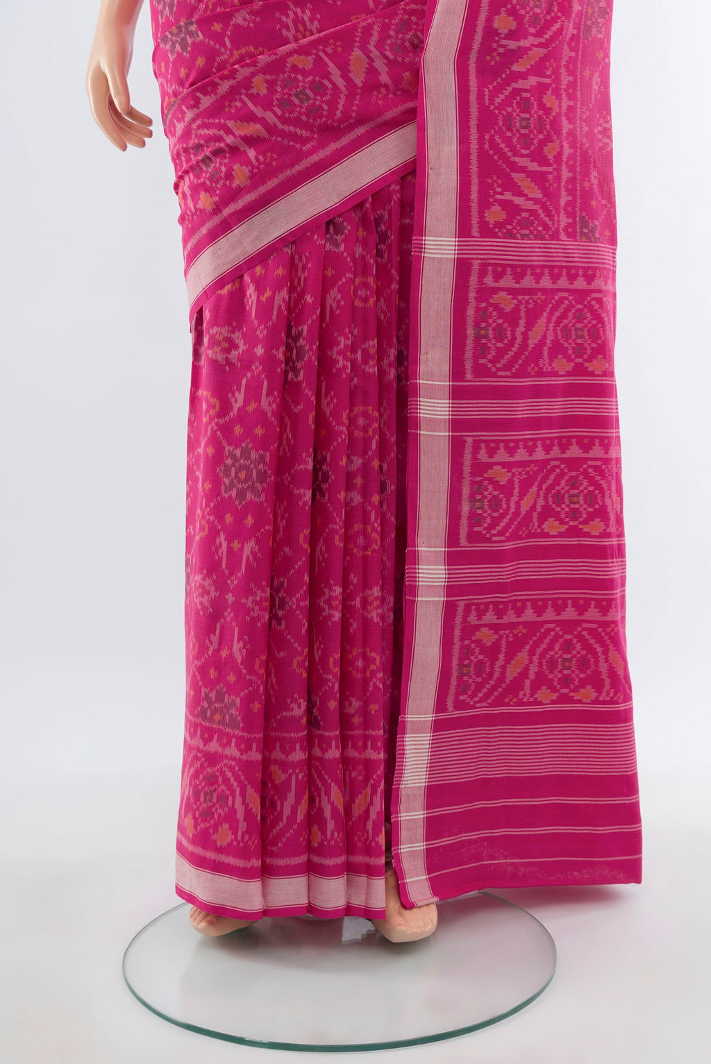 Pleats and pallu of Rani Pink Rajkot Patola Silk Saree with Ikat design on the body and Zari Border. 